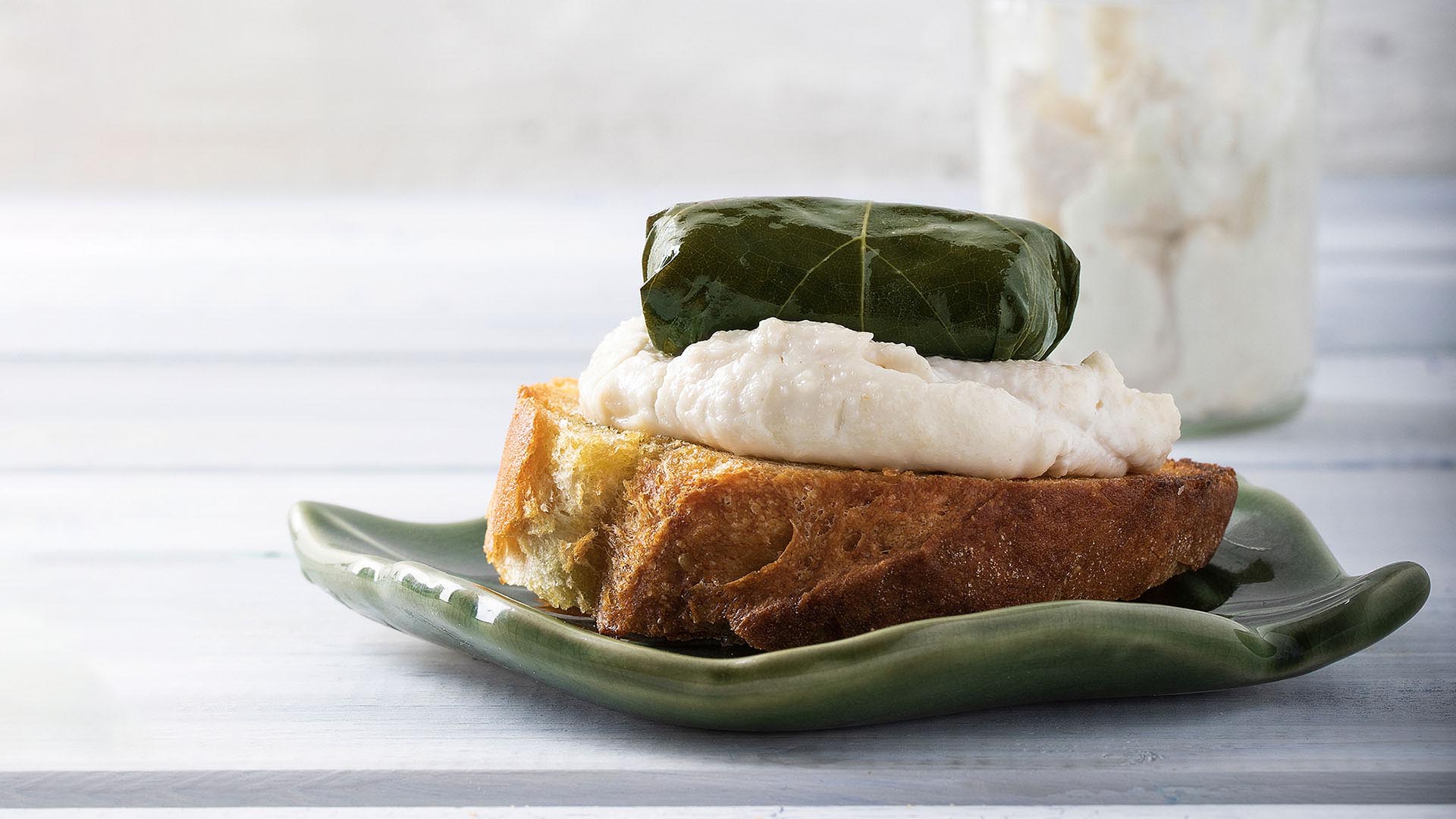 Paliria quinoa dolmas on grilled bread with fish roe cream