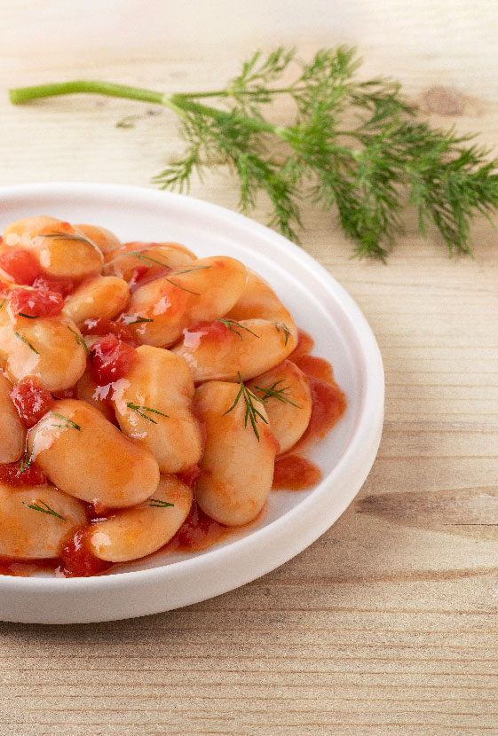 Giant beans in onion & tomato sauce in a plate