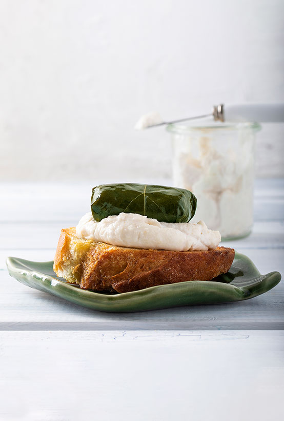 Paliria quinoa dolmas on grilled bread with fish roe cream